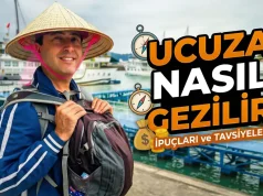 Ucuza Nasıl Gezilir? Gerçekten İşe Yarayan Seyahat Taktikleri Ucuza nasıl gezilir rehberi için sırt çantalı gezgin manzara karşısında